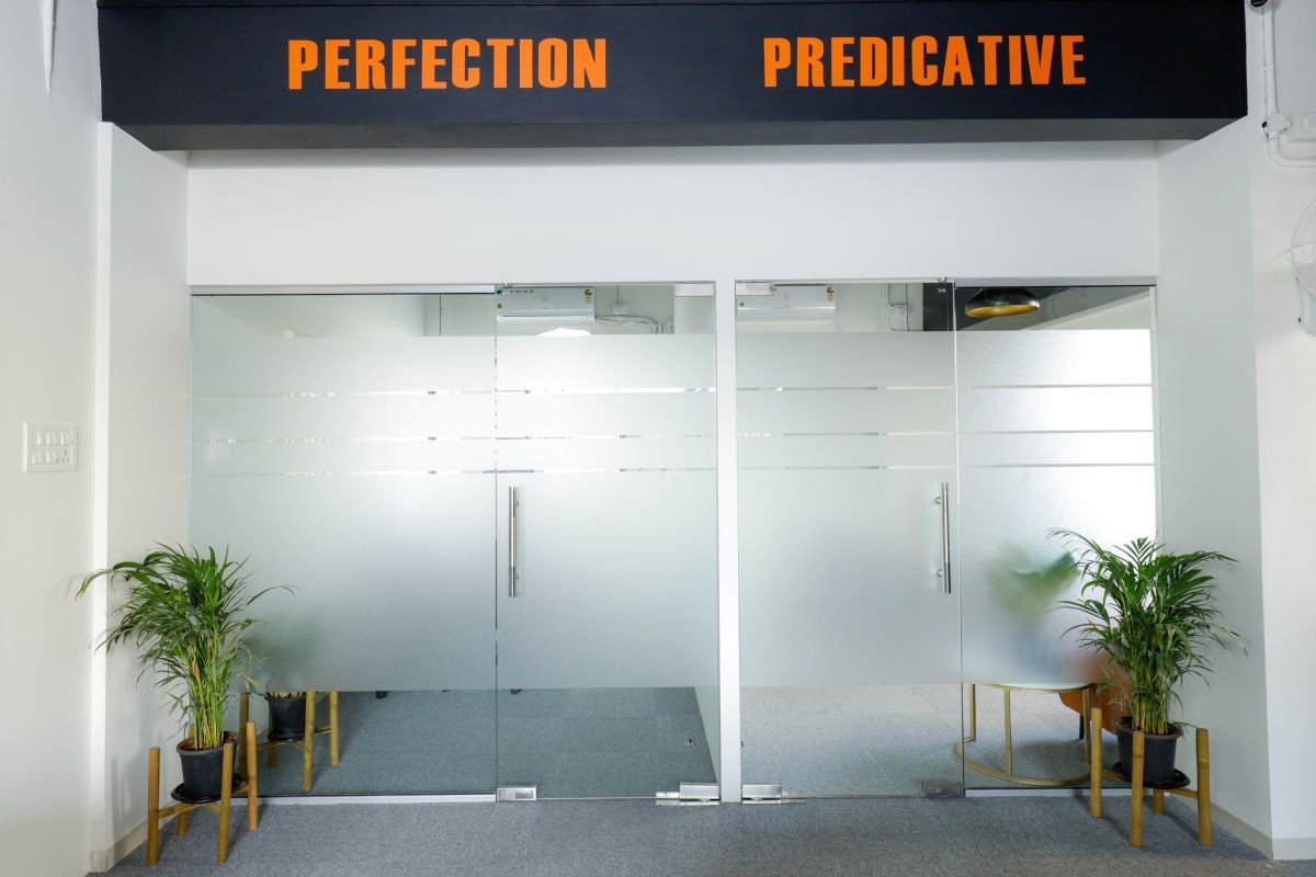 Glass-walled cabins with plants, managed office built by Workin Space