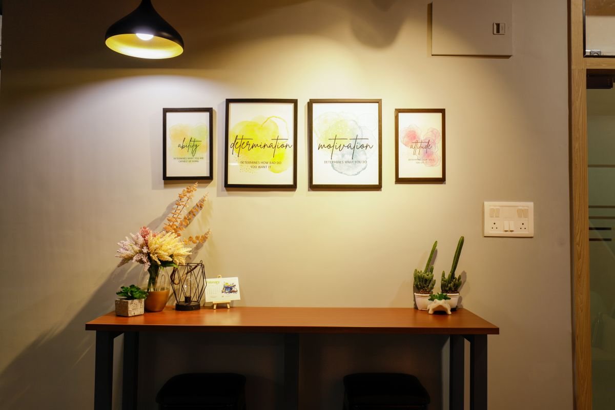 Feature wall with desk and frames, managed office built by Workin Space