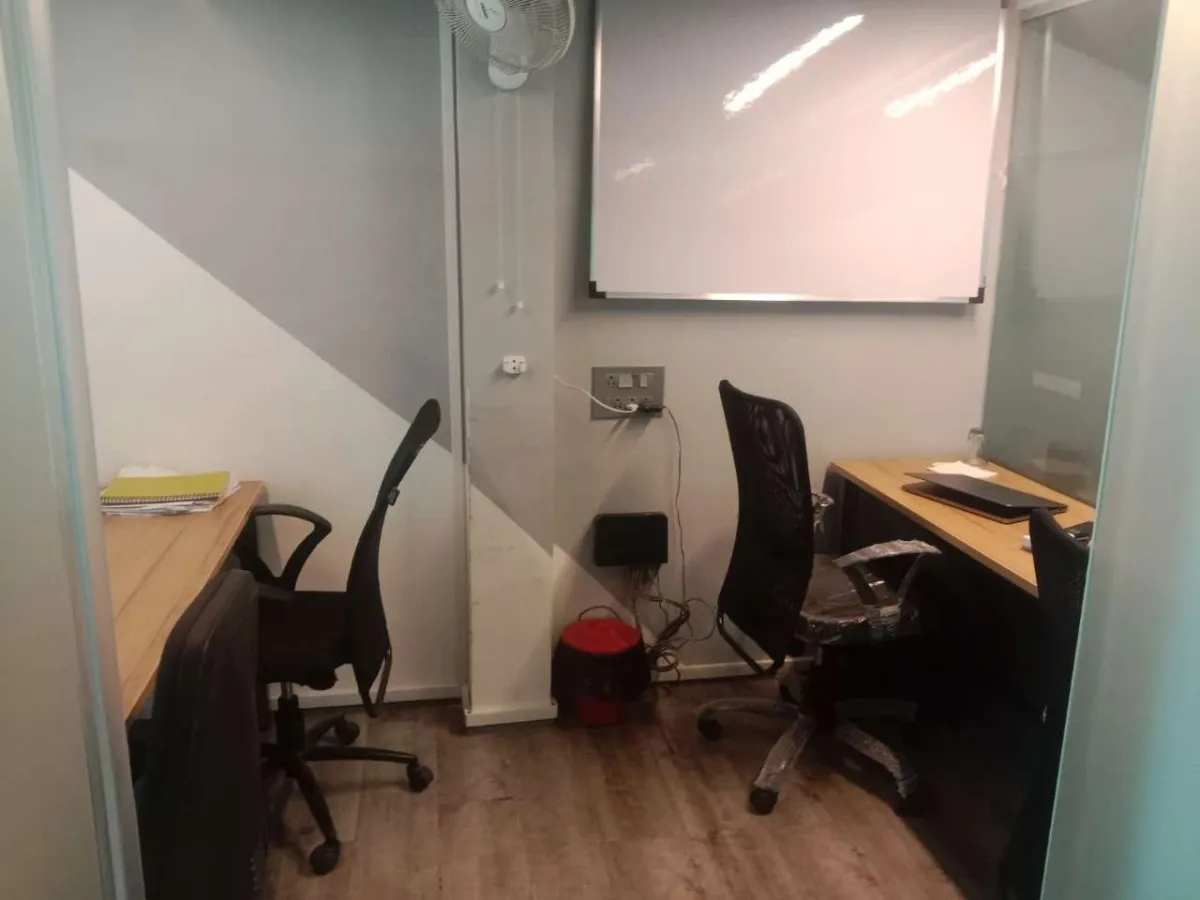 Workin Space interior showcasing a modern coworking environment with comfortable seating and workspace amenities